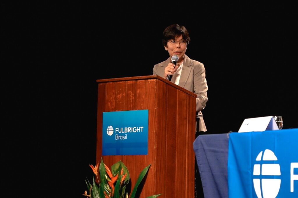 Woman at podium presenting