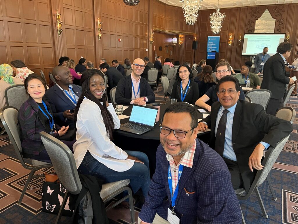 Group of Fulbright scholars sitting around table