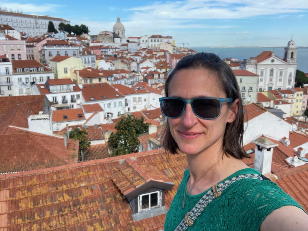 Woman posing in front of view over houses