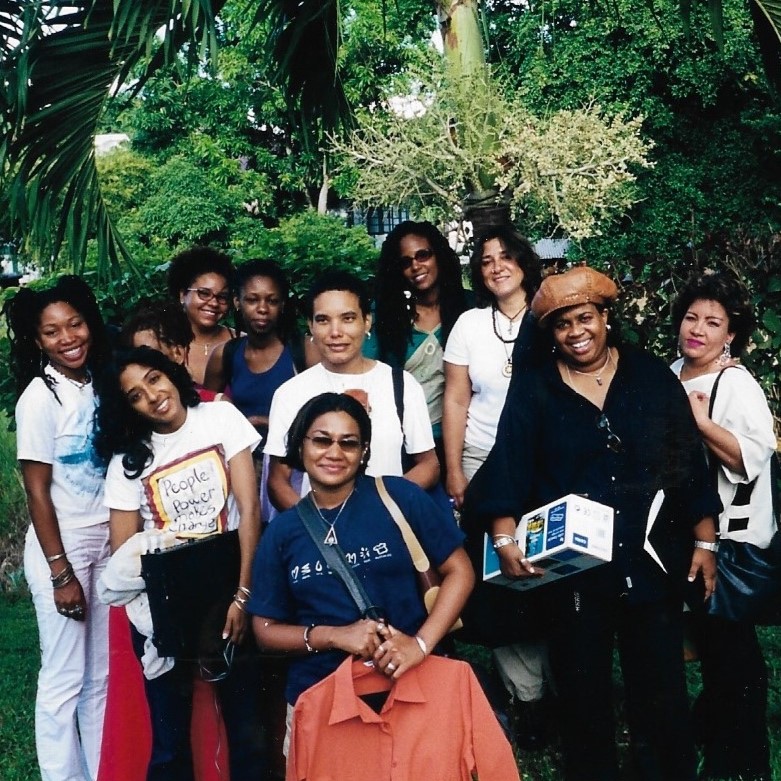 Group of women standing amongst trees in Trinidad & Tobago