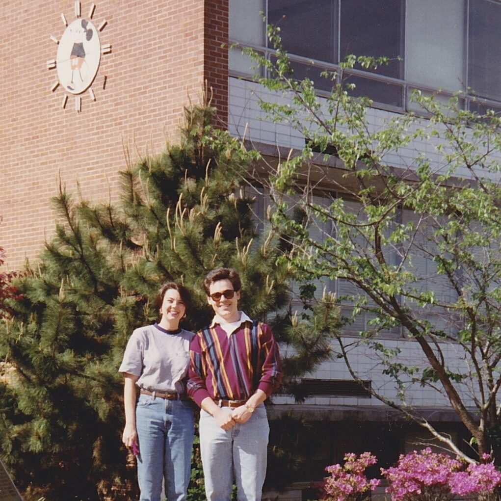 Ángel Cabrera standing with wife in front of building at Georgia Tech