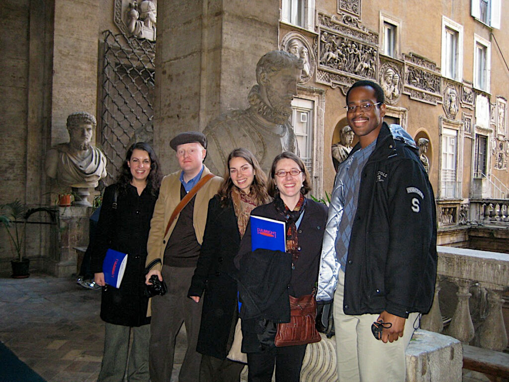 Joseph Hill standing with group in Florence