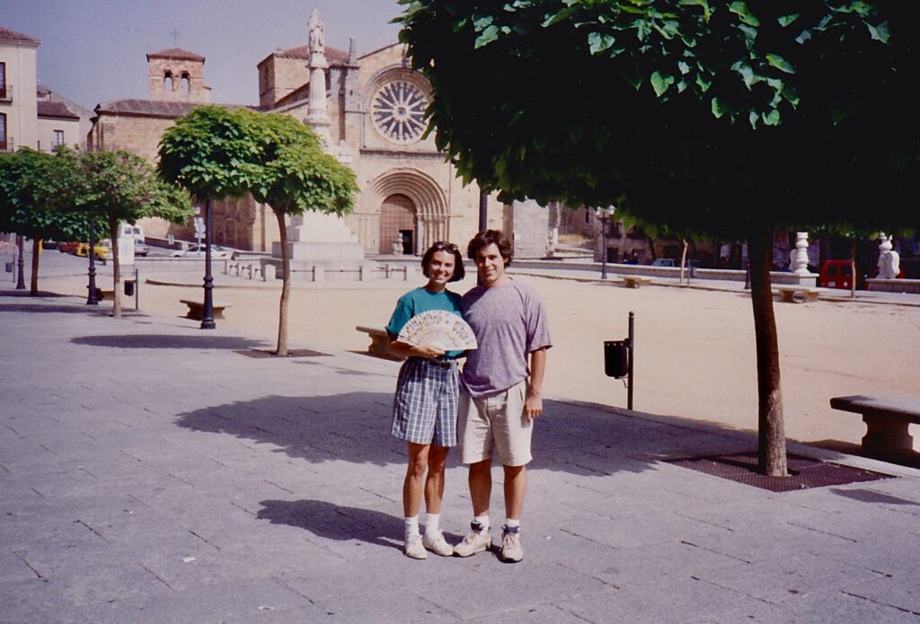 Ángel Cabrera standing with wife in front of church in Spain