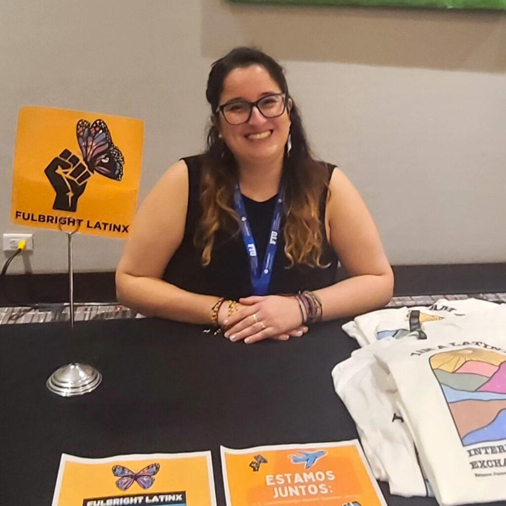 Fulbrigter at conference booth for Fulbright LatinX