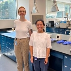 Cancy Chu and Lais Feltrin Sidou standing in lab