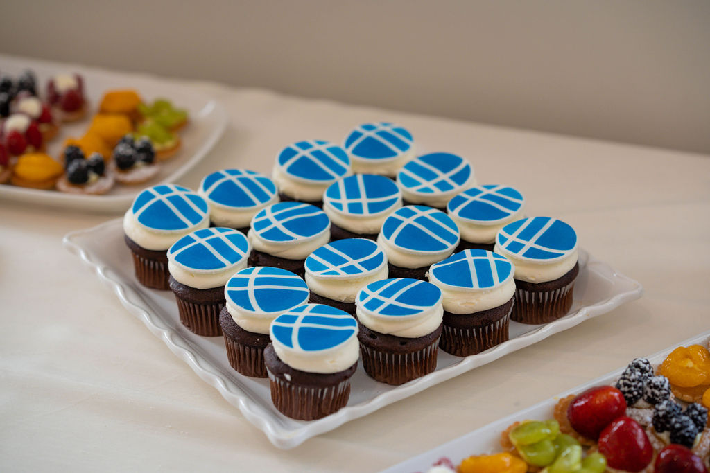 Plate of cupcakes decorated with Fulbright themed icing