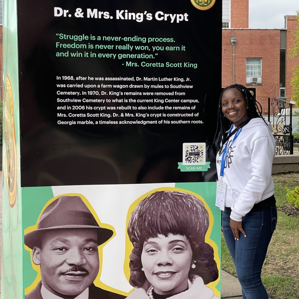 Jeanne standing by sign about Martin Luther King
