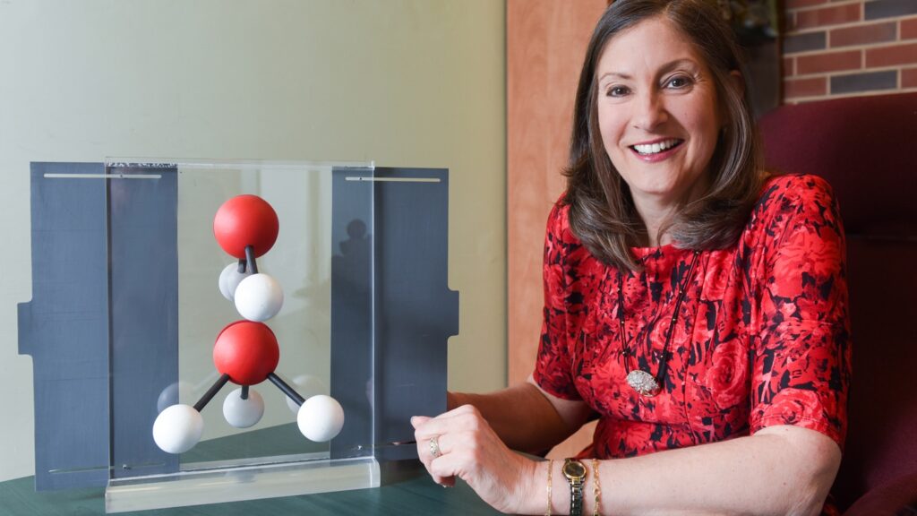 Maria T. Oliver-Hoyo with molecule model