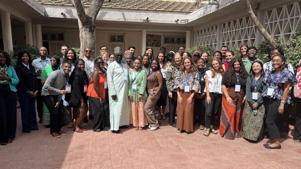 Fulbright Alum and Director Ousmane Sène (center) with large group of people at the West African Research Center (WARC) in Dakar