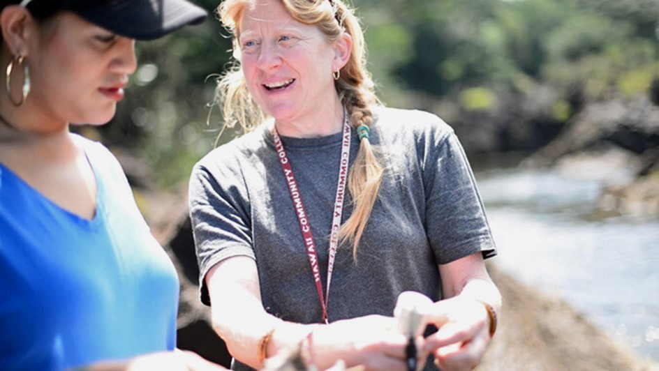 Pam Scheffer demonstrating apparatus to student