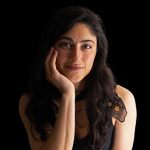 Headshot of Kyrin Pollock with black background