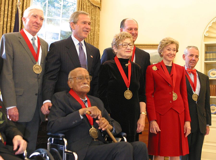 Frank Snowden, Jr., PhD in Oval Office with President George W Bush, receiving the National Humanities Medal with five others all with medals on red ribbons around their necks
