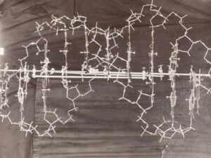 Original model of the double-helix structure of the DNA molecule made out of wire, on a metal stand